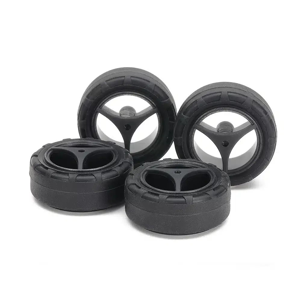 15543.webp TAMIYA 15543 1/32 MINI 4WD SUPER HARD SMALL DIA. NARROW TIRES (24mm) & CARBON WHEELS (3-SPOKE, for SUPER X & XX CHASSIS) - Image 1