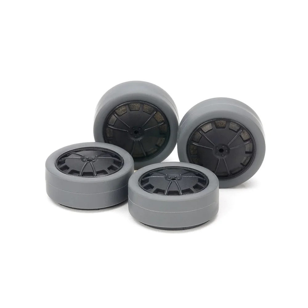 15545.webp TAMIYA 15545 1/32 MINI 4WD HARD SMALL DIA. LOW-PROFILE TIRES (26mm/GRAY) & CARBON WHEELS (DISH, for SUPER X & XX CHASSIS) - Image 1
