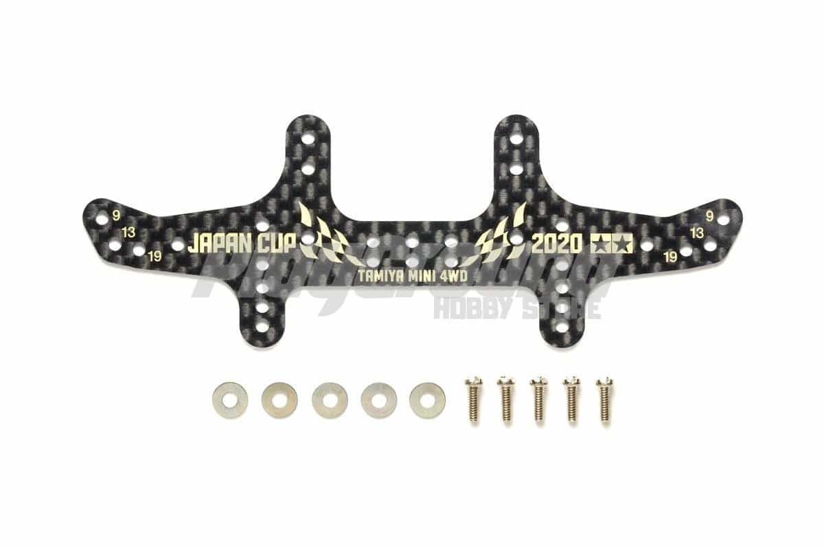 f66f08e85efe3702d1f8d48b7a6dc73a-1.jpg Tamiya 95136 HG Carbon Rear Multi Roller Setting Stay (1.5mm) J-Cup 2020 Gold Print - Image 1